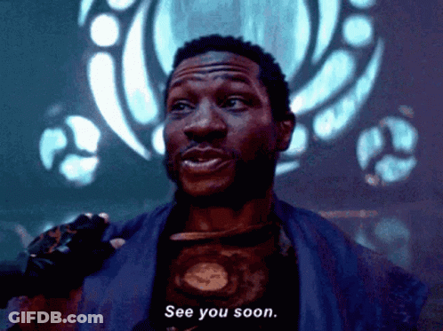 A Man Says See You Soon In Front Of A Blue Background GIF
