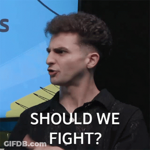 A Man Says Should We Fight In Front Of A Screen GIF