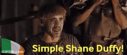 A Man Says Simple Shane Duffy In Front Of A Flag GIF