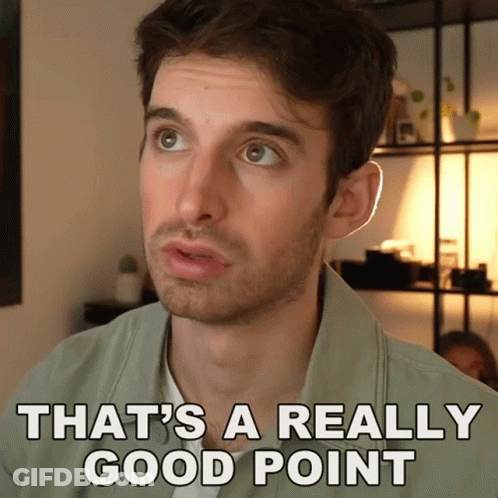 A Man Says That 'S A Really Good Point In Front Of A Shelf GIF