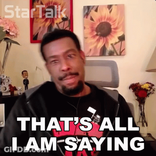 A Man Says That 'S All I Am Saying In Front Of A Wall With Sunflowers GIF