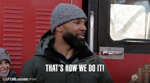 A Man Says That 'S How We Do It While Standing In Front Of A Fire Truck GIF