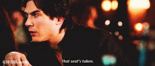 A Man Says " That Seat 'S Taken " In A Blurry Photo GIF