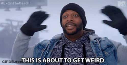 A Man Says This Is About To Get Weird While Wearing Gloves And A Beanie GIF