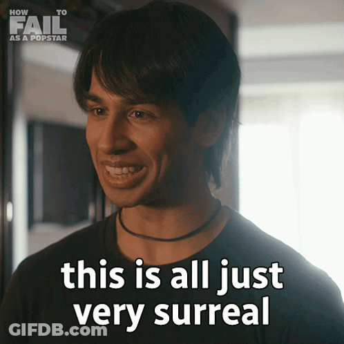 A Man Says " This Is All Just Very Surreal " In Front Of A Sign That Says How To Fail As A Popstar GIF