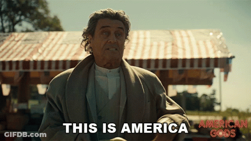A Man Says This Is America In Front Of A Tent GIF