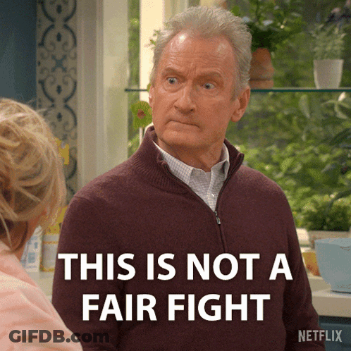 A Man Says This Is Not A Fair Fight In Front Of A Window GIF