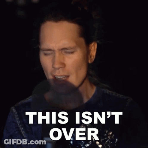 A Man Says This Isn 'T Over In A Dark Room GIF