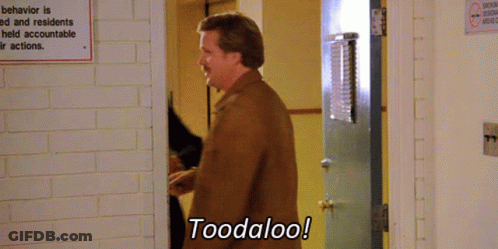 A Man Says Toodaloo In Front Of A Sign That Says Behavior Is Ed And Residents Held Accountable Their Actions GIF