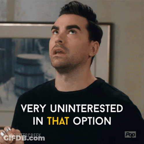 A Man Says Very Uninterested In That Option In Front Of A Framed Picture GIF