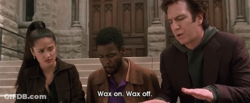 A Man Says Wax On Wax Off In Front Of A Building GIF