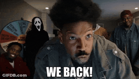 A Man Says We Back In Front Of A Group Of People GIF