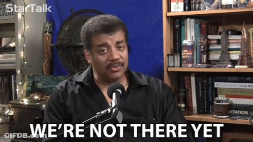 A Man Says We 'Re Not There Yet While Sitting In Front Of A Microphone GIF