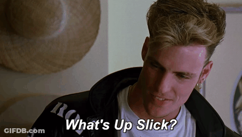 A Man Says " What 'S Up Slick " In Front Of A Hat GIF