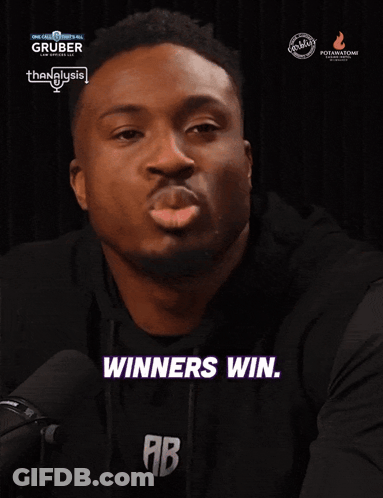 A Man Says Winners Win While Wearing A Black Shirt GIF