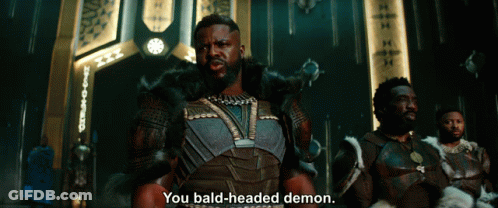 A Man Says You Bald-Headed Demon In Front Of A Group Of Men GIF