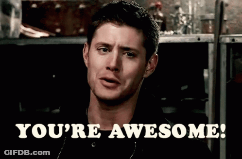 A Man Says " You 'Re Awesome " In Front Of A Dark Background GIF