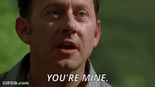 A Man Says " You 'Re Mine " In A Close Up Of His Face GIF
