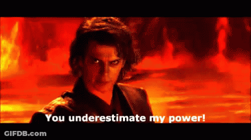 A Man Says You Underestimate My Power In Front Of A Fire Background GIF