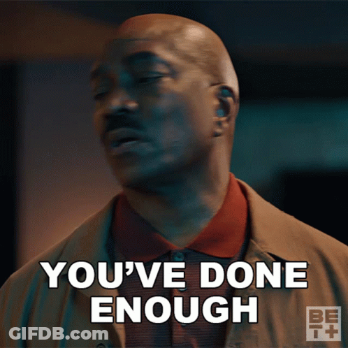 A Man Says " You 'Ve Done Enough " In Front Of A Dark Background GIF