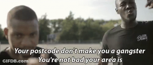 A Man Says " Your Postcode Don 'T Make You A Gangster You 'Re Not Bad Your Area Is " In Front Of Another Man GIF