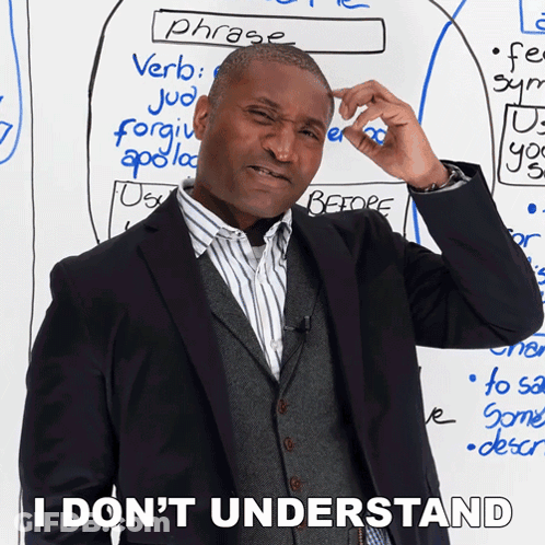 A Man Scratches His Head In Front Of A White Board With Phrases Written On It GIF