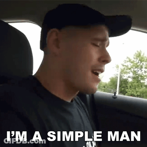 A Man Singing In The Back Seat Of A Car With The Words I 'M A Simple Man Above Him GIF