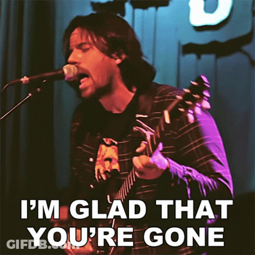 A Man Singing Into A Microphone And Playing A Guitar With The Words I 'M Glad That You 'Re Gone GIF
