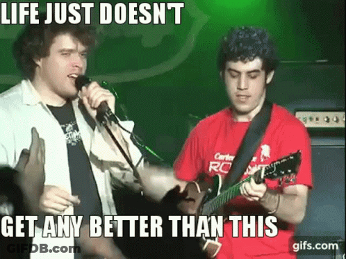 A Man Singing Into A Microphone Next To A Man Playing A Guitar With The Caption Life Just Doesn 'T GIF