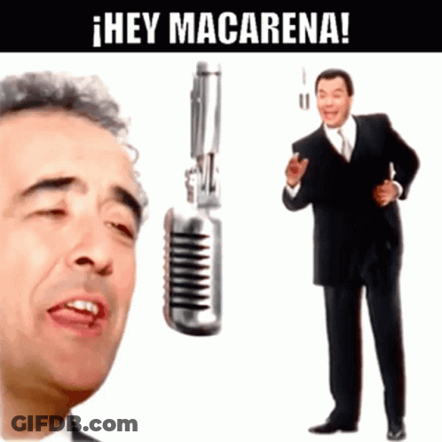 Man Singing Into Microphone Next To Man With Gun GIF