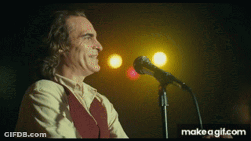Man Singing Into Microphone GIF
