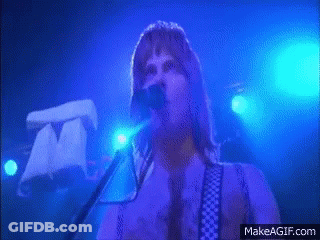 A Man Singing Into A Microphone With Makeagif.com In The Corner GIF