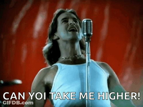 A Man Singing Into A Microphone With The Caption Can You Take Me Higher GIF