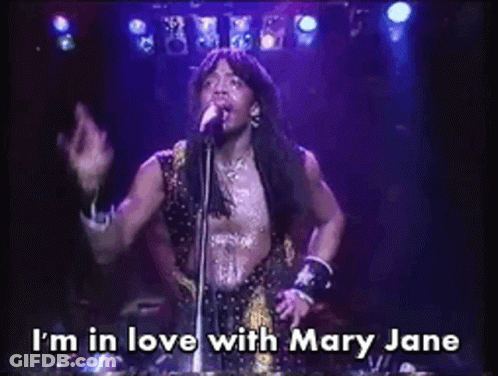 A Man Singing Into A Microphone With The Caption I 'M In Love With Mary Jane GIF