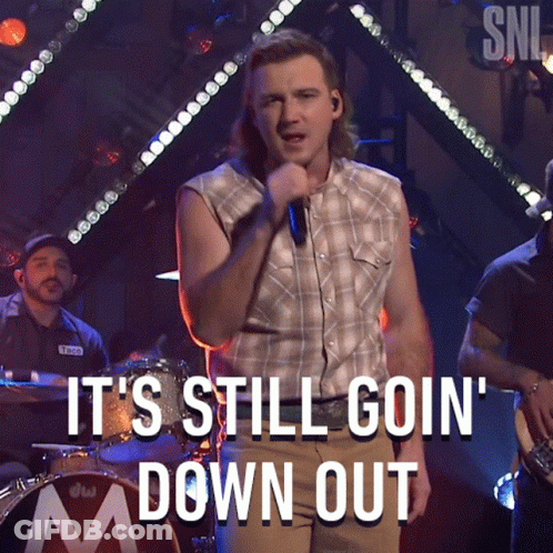 A Man Singing Into A Microphone With The Caption It 'S Still Goin ' Down Out GIF