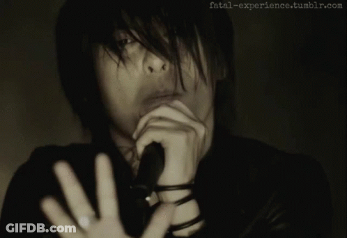 Man Singing Into Microphone GIF