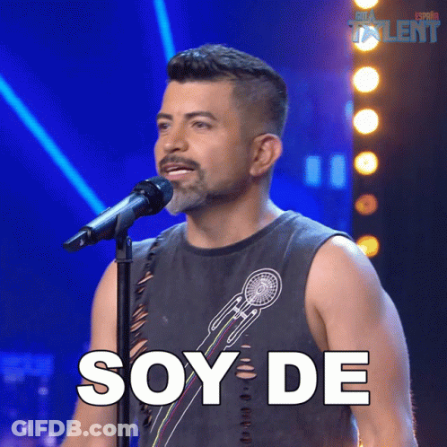 A Man Singing Into A Microphone With The Word Soy De Written In White GIF