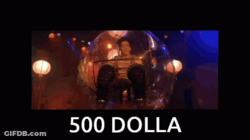 A Man Singing Into A Microphone With The Words 500 Dolla Behind Him GIF