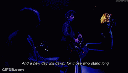 A Man Singing Into A Microphone With The Words " And The Forests Will Echo With Laughter " Next To Him GIF