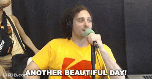 A Man Singing Into A Microphone With The Words Another Beautiful Day GIF
