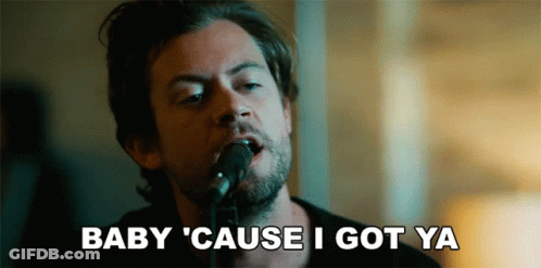 A Man Singing Into A Microphone With The Words Baby Cause I Got Ya Written Below Him GIF
