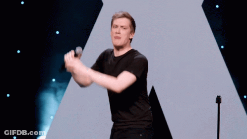 A Man Singing Into A Microphone With The Words Burn It Written Below Him GIF