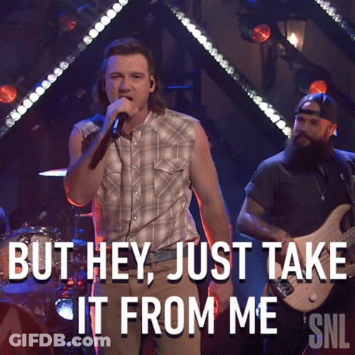 A Man Singing Into A Microphone With The Words But Hey Just Take It From Me GIF