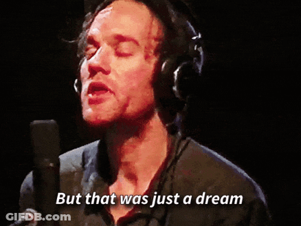 A Man Singing Into A Microphone With The Words But That Was Just A Dream GIF