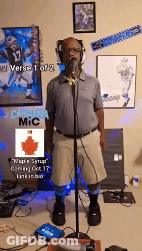 A Man Singing Into A Microphone With The Words Carolina Mic On The Bottom Right GIF