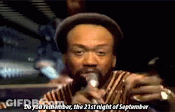 A Man Singing Into A Microphone With The Words Do You Remember The 21St Night Of September GIF