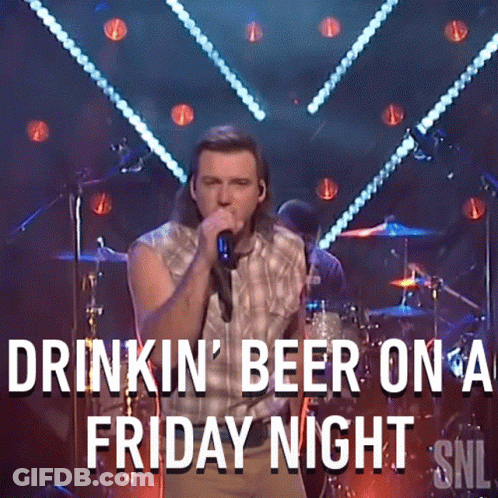A Man Singing Into A Microphone With The Words Drinkin ' Beer On A Friday Night Snl GIF