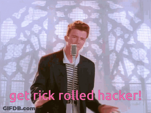 A Man Singing Into A Microphone With The Words Get Rick Rolled Hacker Written Below Him GIF
