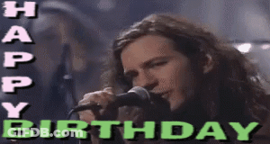 A Man Singing Into A Microphone With The Words Happy Birthday Written Above Him GIF