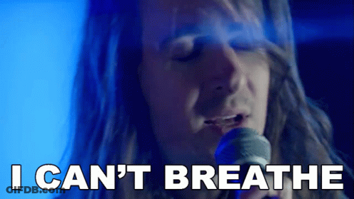 A Man Singing Into A Microphone With The Words " I Can 'T Breathe " Next To Him GIF